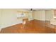 Bright living room with hardwood floors flowing into dining and kitchen area at 8745 Sw 92Nd St # B, Ocala, FL 34481