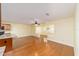Open-concept living room features hardwood floors and transitions into kitchen at 8745 Sw 92Nd St # B, Ocala, FL 34481