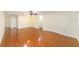 Spacious open-concept living room featuring hardwood floors, neutral walls, and natural light at 8745 Sw 92Nd St # B, Ocala, FL 34481