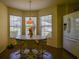 Cozy breakfast nook with bay windows offering views of the front yard, perfect for morning coffee at 9068 Se 120Th Loop, Summerfield, FL 34491