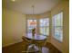 Inviting breakfast nook featuring large windows that flood the space with natural light, creating a bright and airy feel at 9068 Se 120Th Loop, Summerfield, FL 34491