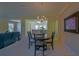 Charming dining area featuring a chandelier and space for a round table at 9068 Se 120Th Loop, Summerfield, FL 34491