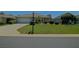 Attractive home with a well-manicured lawn, mature shrubs, and a two-car garage at 9068 Se 120Th Loop, Summerfield, FL 34491