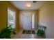 Bright foyer featuring neutral walls, decorative light fixture, and tile flooring at 9068 Se 120Th Loop, Summerfield, FL 34491