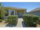 Well-maintained home with manicured landscaping creating a welcoming curb appeal at 9068 Se 120Th Loop, Summerfield, FL 34491