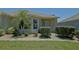 Charming home with meticulously maintained front yard, featuring lush landscaping and a welcoming entrance at 9068 Se 120Th Loop, Summerfield, FL 34491