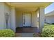 Inviting front porch with decorative columns, and well-manicured landscaping, perfect for relaxing outdoors at 9068 Se 120Th Loop, Summerfield, FL 34491