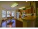Bright eat-in kitchen with wood cabinets and modern appliances next to a bay window at 9068 Se 120Th Loop, Summerfield, FL 34491