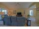 Comfortable living room with vaulted ceilings and natural light from sliding glass doors at 9068 Se 120Th Loop, Summerfield, FL 34491