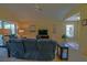 Comfortable living room with vaulted ceilings and natural light from sliding glass doors at 9068 Se 120Th Loop, Summerfield, FL 34491