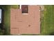 Aerial view of the house roof with vents surrounded by the green lawn at 9891 Se 138Th Loop, Summerfield, FL 34491