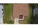 Birds eye view of a home's brown roof, landscaped yard and green lawn at 9891 Se 138Th Loop, Summerfield, FL 34491