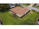 Elevated perspective on the home, highlighting yard, and outdoor living space at 9891 Se 138Th Loop, Summerfield, FL 34491