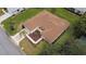 Aerial view showcasing a home's roof, landscaping, and well-kept lawn at 9891 Se 138Th Loop, Summerfield, FL 34491