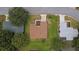 Bird's-eye view of the property featuring green lawns and manicured landscaping at 9891 Se 138Th Loop, Summerfield, FL 34491