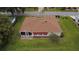 Aerial shot of the house featuring a backyard with a patio and awning at 9891 Se 138Th Loop, Summerfield, FL 34491