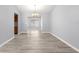 Bright dining area with modern flooring, pendant lighting, and easy access to the kitchen, perfect for entertaining at 9891 Se 138Th Loop, Summerfield, FL 34491