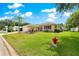 Lovely single-story home with a well-kept lawn and landscaping at 9891 Se 138Th Loop, Summerfield, FL 34491