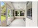 Enclosed lanai with multiple windows provides ample natural light and views of the outdoors at 9891 Se 138Th Loop, Summerfield, FL 34491
