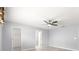 Main bedroom has ceiling fan and en suite bathroom and walk-in closet at 9891 Se 138Th Loop, Summerfield, FL 34491