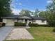 Charming single-story home with a well-manicured lawn and inviting front entrance at 1101 Se 33Rd Ave, Ocala, FL 34471