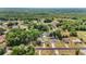 Expansive aerial shot showcasing the neighborhood and dense tree coverage of surrounding area at 111 Almond Rd, Ocala, FL 34472