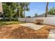 Beautiful backyard featuring a stone patio and fire pit, perfect for outdoor entertaining at 111 Almond Rd, Ocala, FL 34472