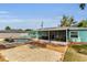 Aerial view of backyard pool, patio, covered patio, shed and privacy fence at 111 Almond Rd, Ocala, FL 34472