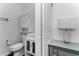 Bathroom featuring a new toilet, built-in medicine cabinet, and modern finishes at 111 Almond Rd, Ocala, FL 34472