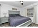 Cozy bedroom featuring a ceiling fan, laminate floors, and serene light blue accents at 111 Almond Rd, Ocala, FL 34472