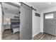 Comfortable bedroom with barn door access and a soothing color palette at 111 Almond Rd, Ocala, FL 34472