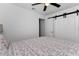 Clean bedroom with ceiling fan and closet at 111 Almond Rd, Ocala, FL 34472