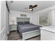Serene bedroom featuring laminate floors, a ceiling fan and a light-blue color palette at 111 Almond Rd, Ocala, FL 34472