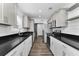 Beautiful kitchen with stainless steel appliances, granite countertops, and plenty of storage at 111 Almond Rd, Ocala, FL 34472