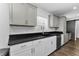 Kitchen featuring white cabinets, granite countertops, and stainless steel appliances at 111 Almond Rd, Ocala, FL 34472