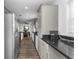 Bright kitchen with modern cabinets, black countertops, and stainless steel appliances at 111 Almond Rd, Ocala, FL 34472
