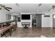 Spacious living room featuring an open layout, a sliding barn door, and a dining table at 111 Almond Rd, Ocala, FL 34472
