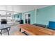 Large covered and screened in patio area with dining table and seating with outdoor kitchen at 111 Almond Rd, Ocala, FL 34472
