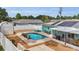 Aerial view of a backyard with a refreshing pool, patio, screened in porch, and shed at 111 Almond Rd, Ocala, FL 34472