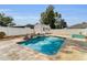 Backyard swimming pool with brick pavers and a white privacy fence and shed at 111 Almond Rd, Ocala, FL 34472