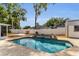 Backyard swimming pool with waterfalls, patio, privacy fence and landscaping at 111 Almond Rd, Ocala, FL 34472