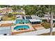 Aerial view of backyard with refreshing pool, screen porch, privacy fence and solar panels at 111 Almond Rd, Ocala, FL 34472