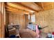 Interior view of shed with unfinished walls and a window providing natural light at 111 Almond Rd, Ocala, FL 34472
