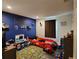 bedroom with dark blue accent wall and playful decor at 120 Fisher Ct, Ocklawaha, FL 32179