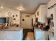 Bright kitchen featuring white cabinets, granite countertops, stainless appliances and vinyl flooring at 120 Fisher Ct, Ocklawaha, FL 32179