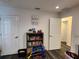 Playroom with dark floors and plenty of storage at 120 Fisher Ct, Ocklawaha, FL 32179