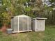 Backyard view of two storage sheds located on the property at 120 Fisher Ct, Ocklawaha, FL 32179