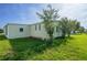 Backyard with grass and foliage at 1228 Maria Ct, Lady Lake, FL 32159