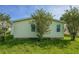 Backyard with grass and foliage at 1228 Maria Ct, Lady Lake, FL 32159