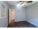 Bedroom with wood-look floors and a ceiling fan at 1228 Maria Ct, Lady Lake, FL 32159